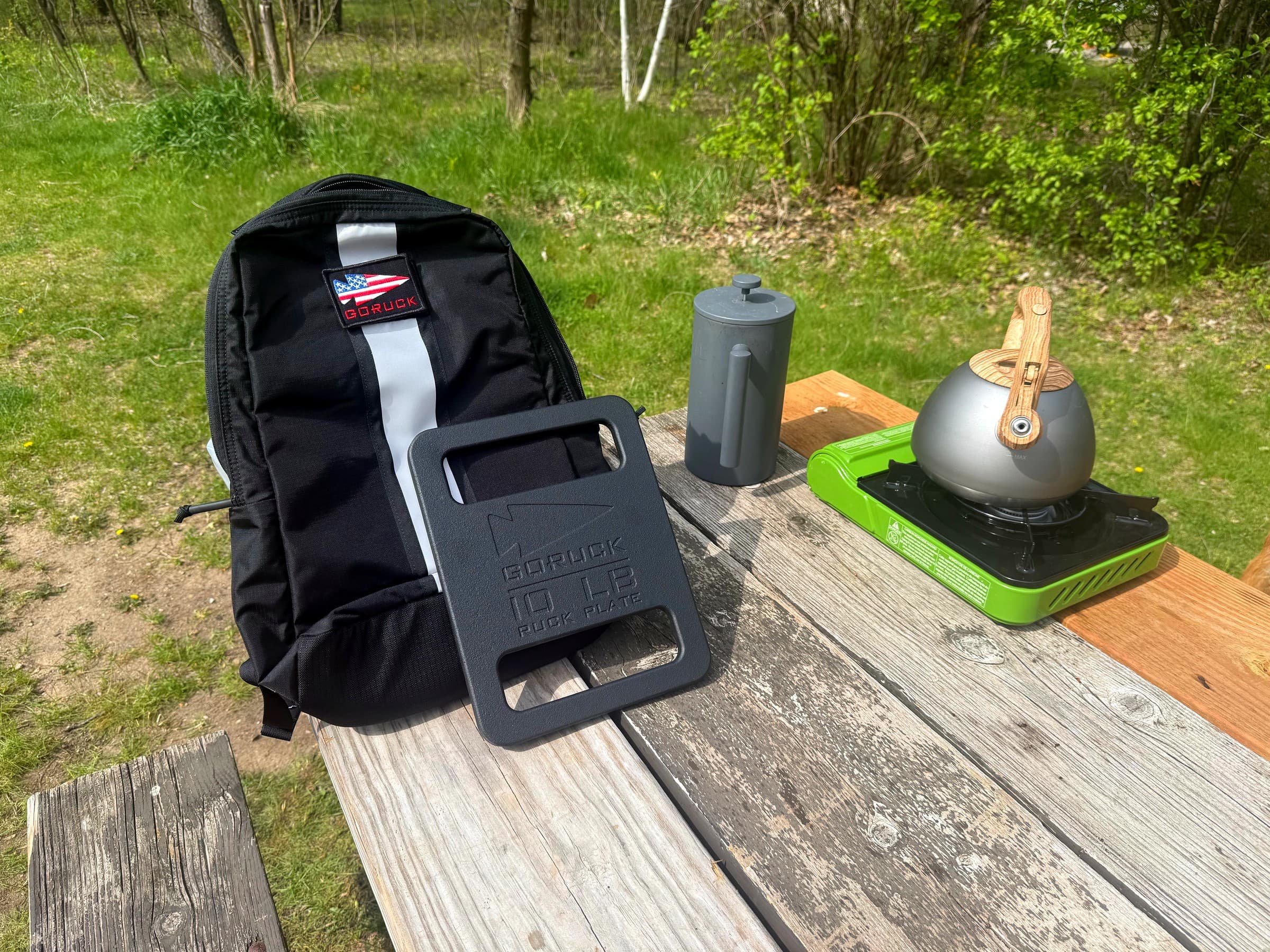 A GORUCK pack and ten-pound plate photographed during Ruck Authority field testing